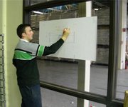 Macdara Butler  Using Magic Whiteboard in a dusty warehouse environment.