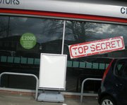 Magic Blackout Blind used to temporarily blackout car showroom windows for a new car launch