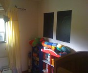 Magic Blackout Blind stuck to a wall in nursery when not in use on window